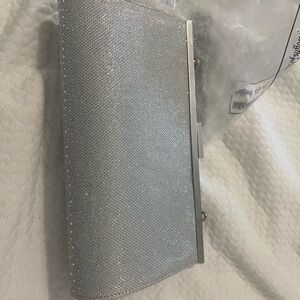 large silver clutch purse with silver chain